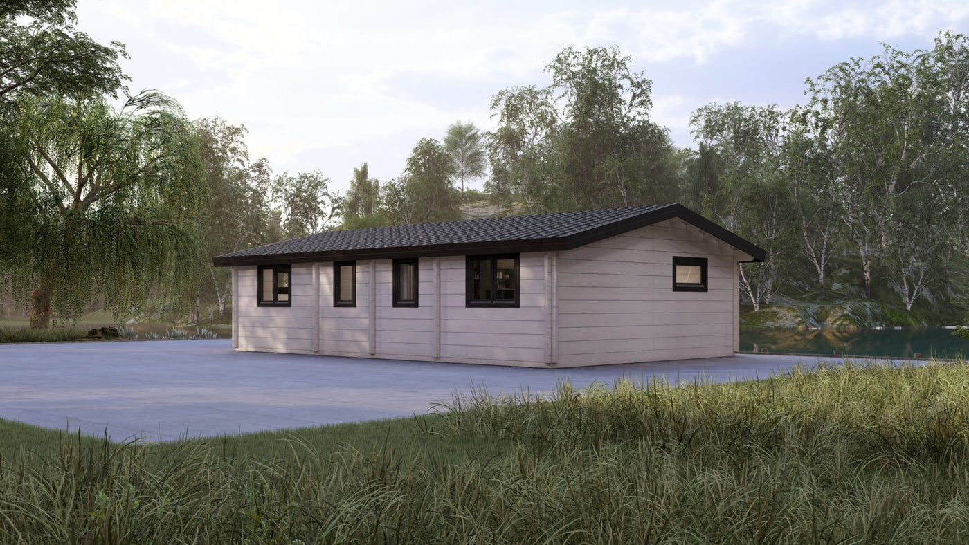 Modern bespoke log cabin on concrete base surrounded by trees, custom timber building design