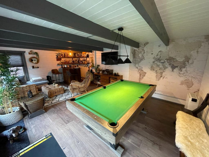 games room log cabin with pool table and bar