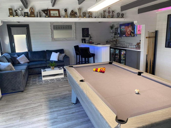 log cabin with a bar and pub pool table