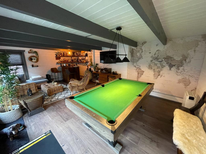 games room log cabin with pool table and bar