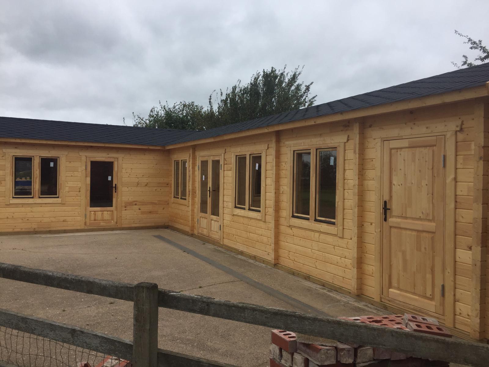 TBS139 L-Shaped Log Cabin | 13.0x7.0m - Timber Building Specialists